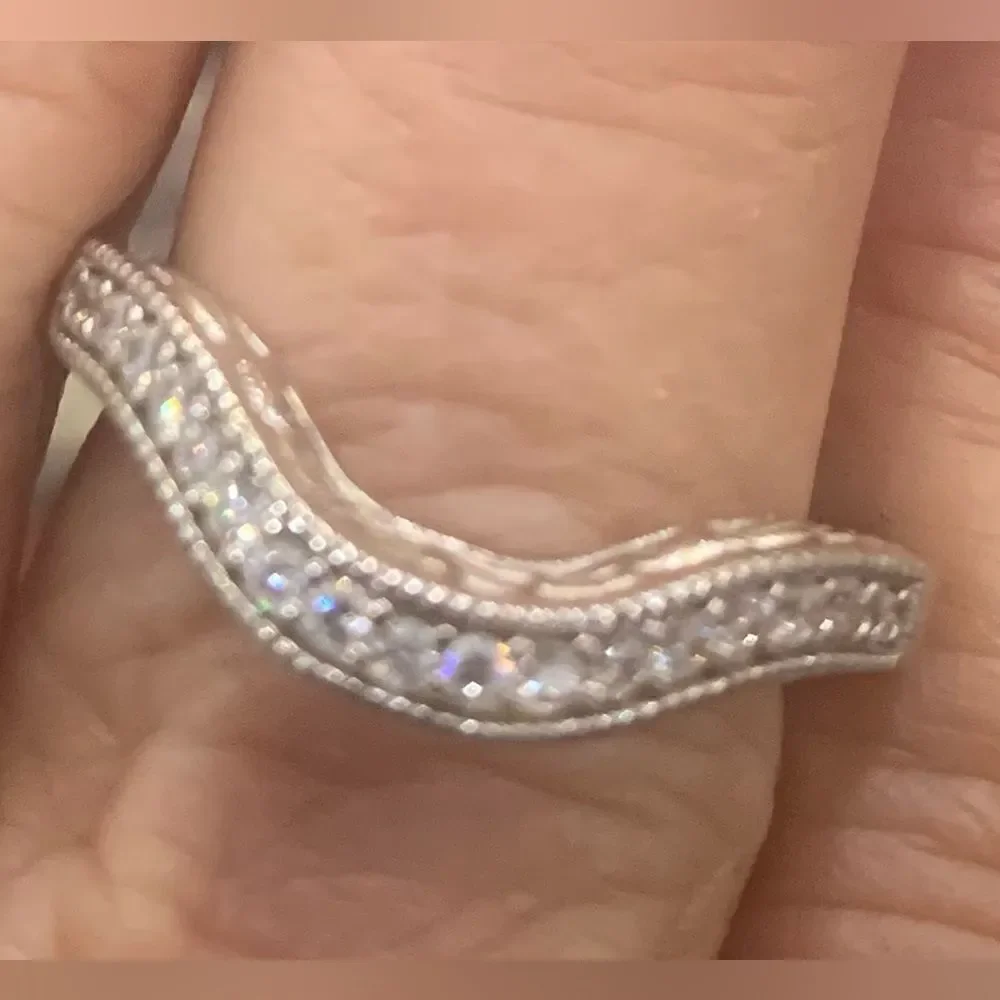 Lovely emerald cut solitaire with a pretty ring guard . Size 9 . Rhodium plated